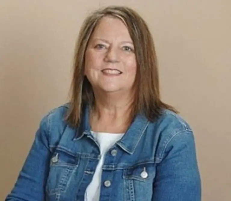 a woman in a denim jacket