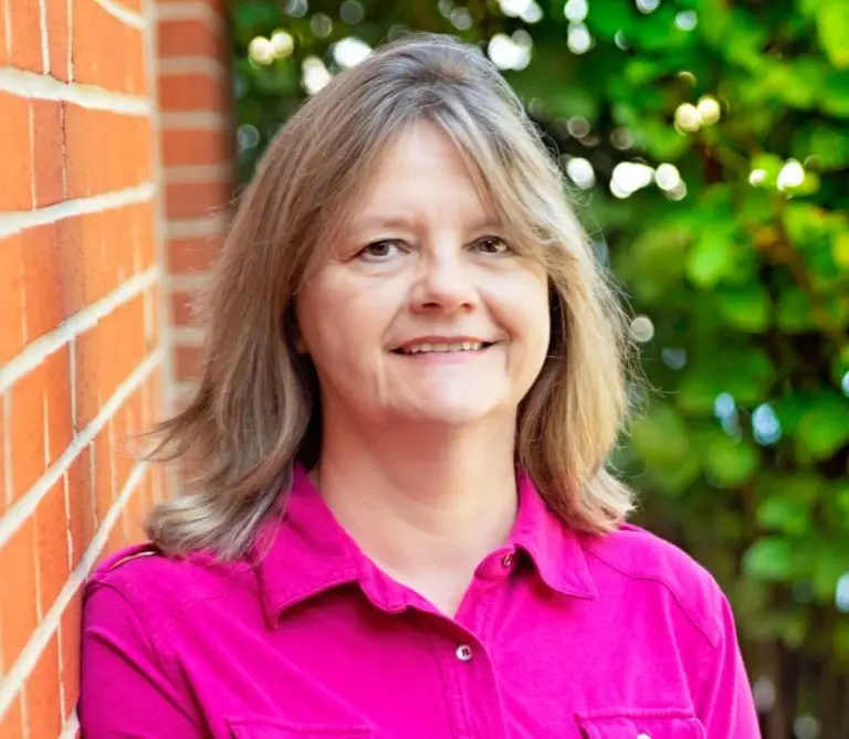 a woman in a pink shirt